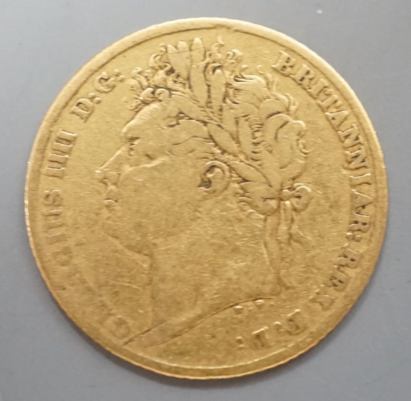 A George IV gold half sovereign, 1823, about F.